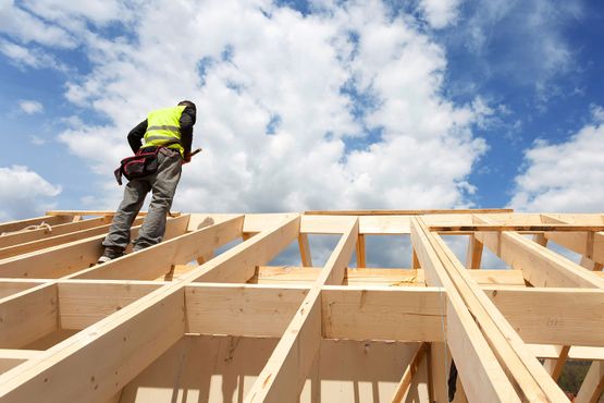 A roofer on a new roof installation 